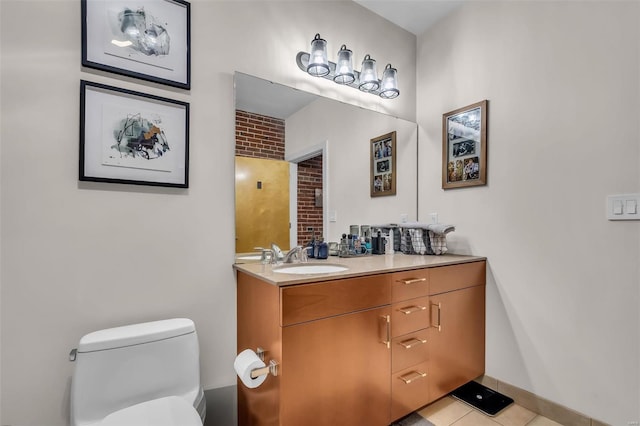 bathroom featuring vanity, toilet, and tile patterned floors