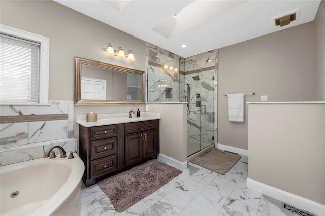 bathroom with vanity, a skylight, and independent shower and bath