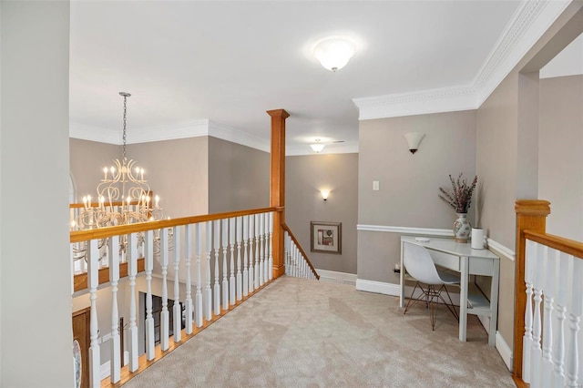 hallway with light carpet, an inviting chandelier, and crown molding