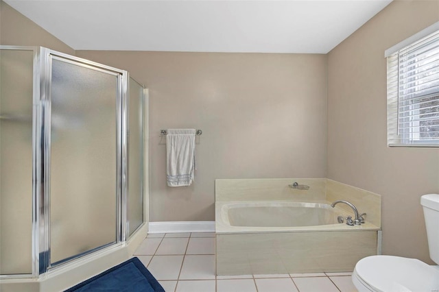 bathroom featuring tile patterned floors, toilet, and shower with separate bathtub