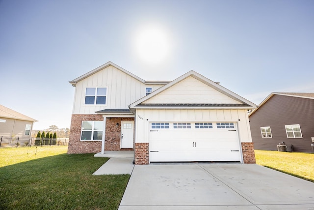 view of front of home with a front yard, board and batten siding, and brick siding