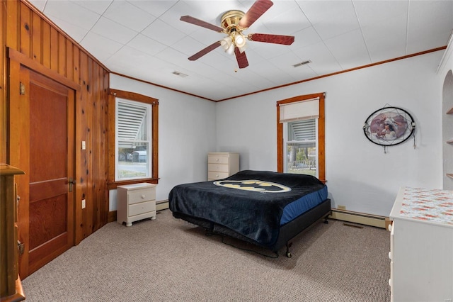 bedroom featuring a baseboard radiator, crown molding, carpet floors, and ceiling fan