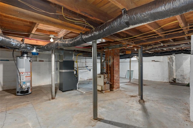 basement with heating unit and water heater