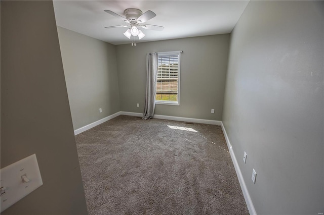 unfurnished room with carpet and ceiling fan