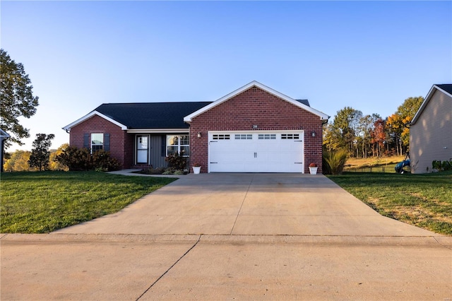 view of front facade with a front lawn and a garage