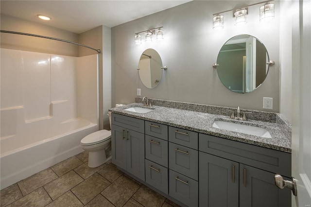 full bathroom with vanity, tub / shower combination, toilet, and tile patterned flooring