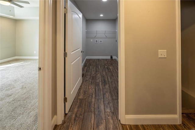 corridor with dark hardwood / wood-style flooring