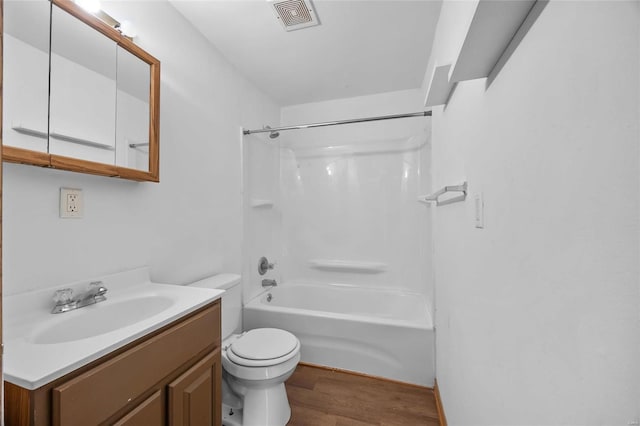 full bathroom featuring shower / tub combination, toilet, vanity, and hardwood / wood-style flooring