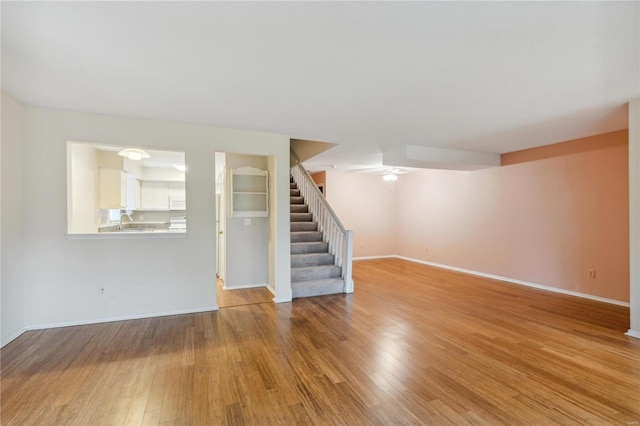 unfurnished living room with hardwood / wood-style floors