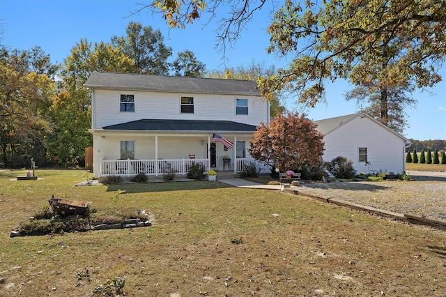 front facade with a porch and a front lawn