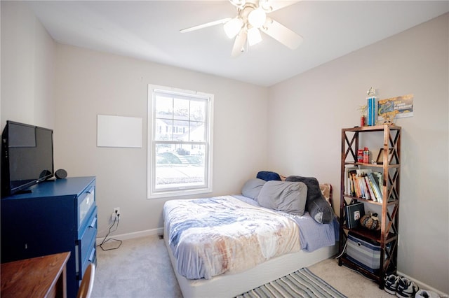 bedroom with light carpet and ceiling fan