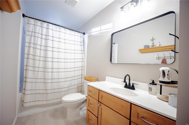 full bathroom featuring vanity, shower / tub combo, toilet, and lofted ceiling