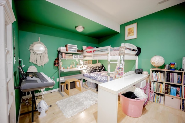 bedroom with light hardwood / wood-style flooring