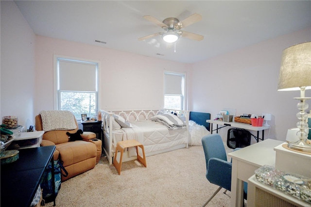 carpeted bedroom with ceiling fan