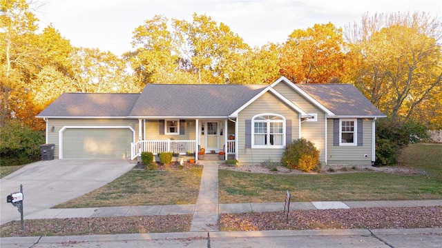 single story home featuring a front yard, a garage, and a porch