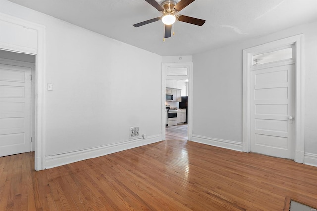 unfurnished room with ceiling fan and light hardwood / wood-style flooring