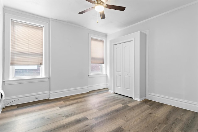 unfurnished room featuring ceiling fan, hardwood / wood-style flooring, and plenty of natural light