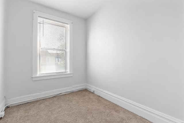 carpeted empty room featuring plenty of natural light