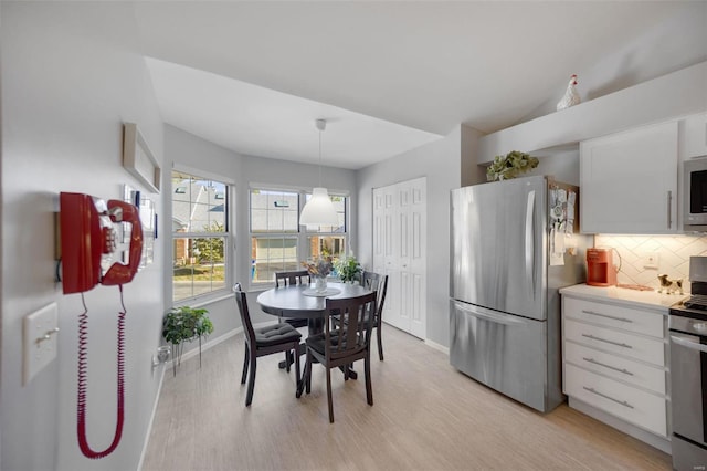 dining room with light wood-type flooring