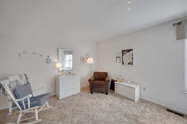 sitting room with light carpet