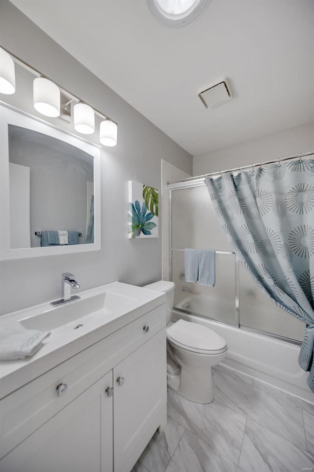 full bathroom with vanity, shower / bath combo with shower curtain, and toilet