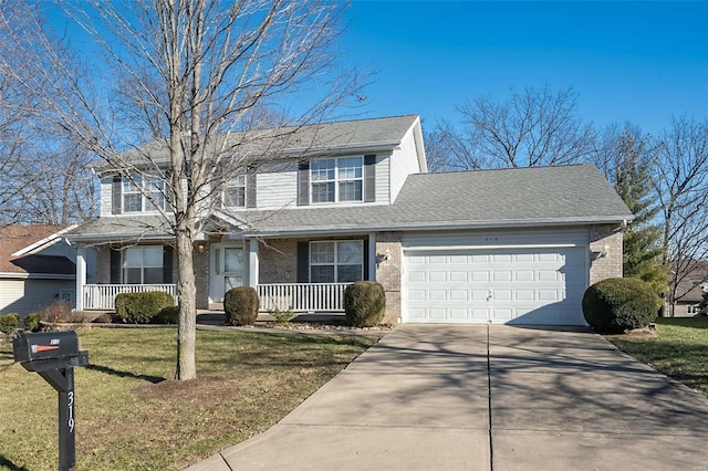 view of property featuring covered porch, a front lawn, and a garage