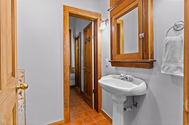 bathroom with tile patterned floors