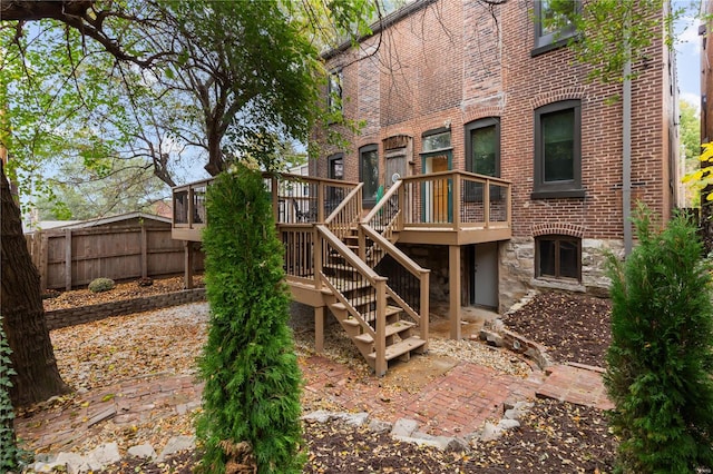 back of house featuring a deck