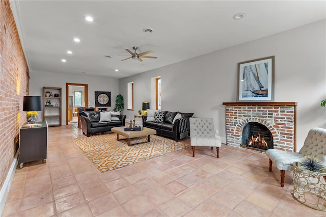 tiled living room with ceiling fan and a fireplace