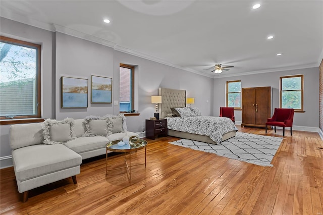 bedroom with ceiling fan, light hardwood / wood-style flooring, and crown molding