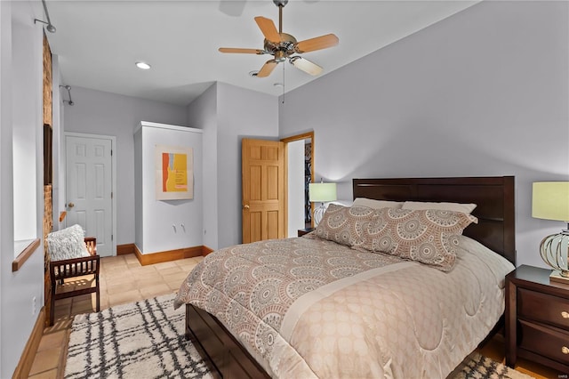 tiled bedroom with ceiling fan