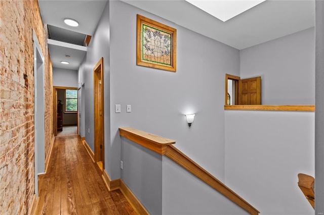 hall with hardwood / wood-style floors