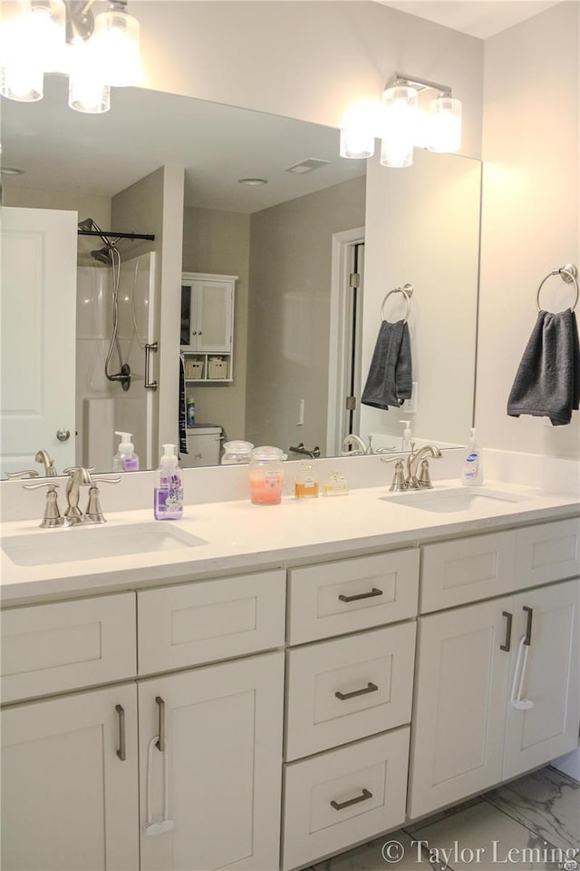 bathroom featuring vanity and walk in shower