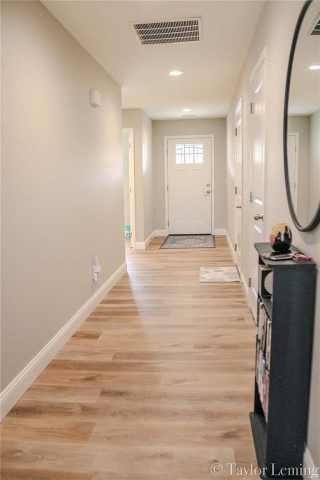 entryway with light hardwood / wood-style floors