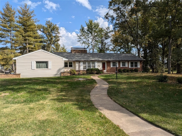 ranch-style house featuring a front lawn