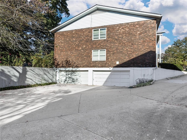 view of property exterior featuring a garage