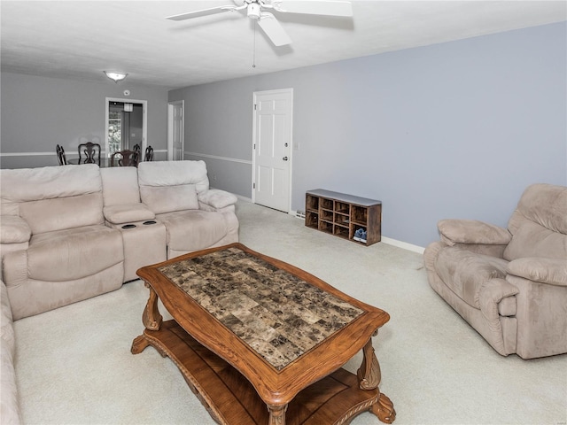 carpeted living room featuring ceiling fan