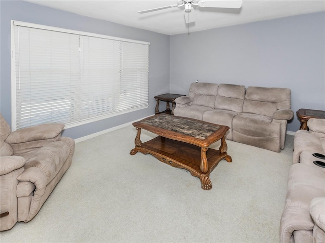 living room featuring carpet flooring and ceiling fan