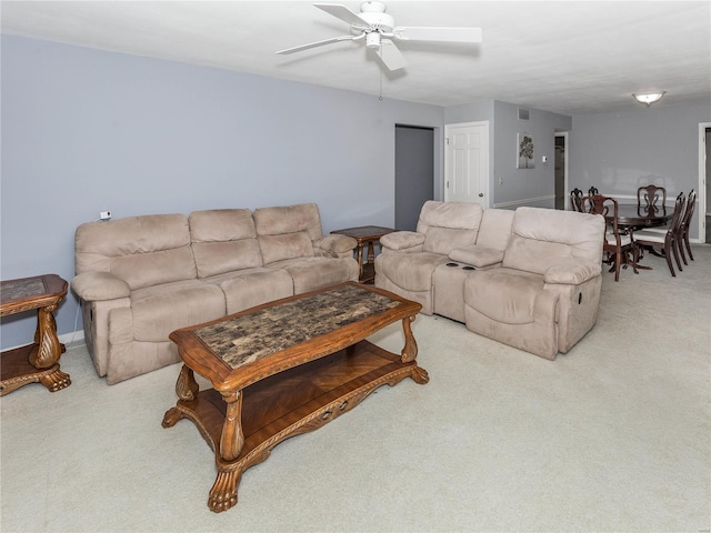 living room featuring light colored carpet and ceiling fan