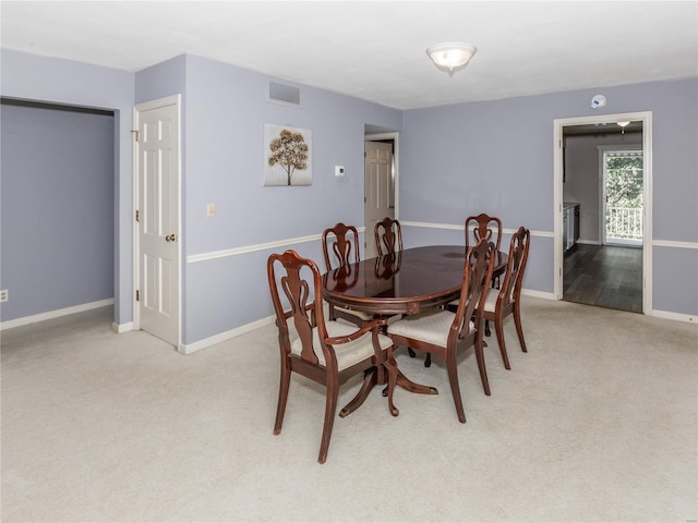 view of carpeted dining space