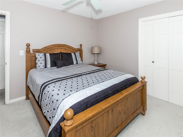 carpeted bedroom with a closet and ceiling fan