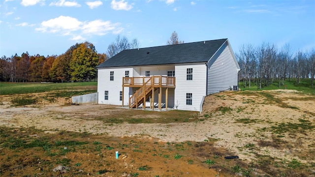 back of house with a wooden deck