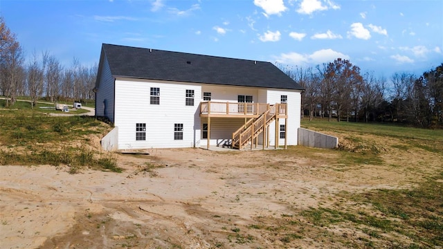 rear view of house featuring a deck