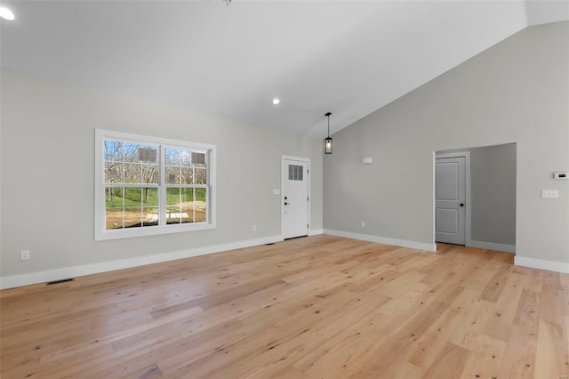 interior space with vaulted ceiling and light wood-type flooring