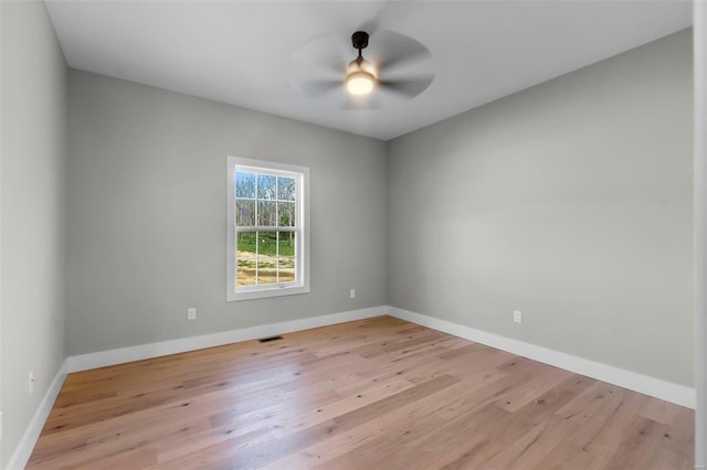 spare room with ceiling fan and light hardwood / wood-style flooring