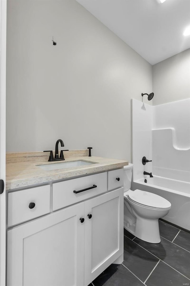 full bathroom featuring tile patterned floors, vanity, toilet, and shower / bathing tub combination