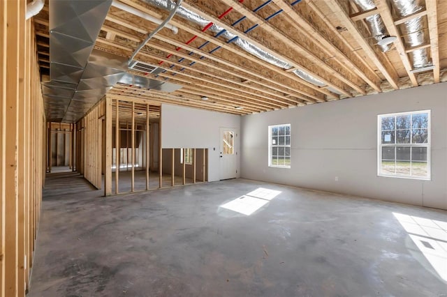 misc room featuring a wealth of natural light and concrete flooring