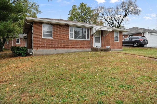 ranch-style house with a garage and a front lawn