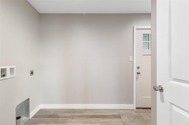 laundry area with hookup for an electric dryer, washer hookup, and light wood-type flooring