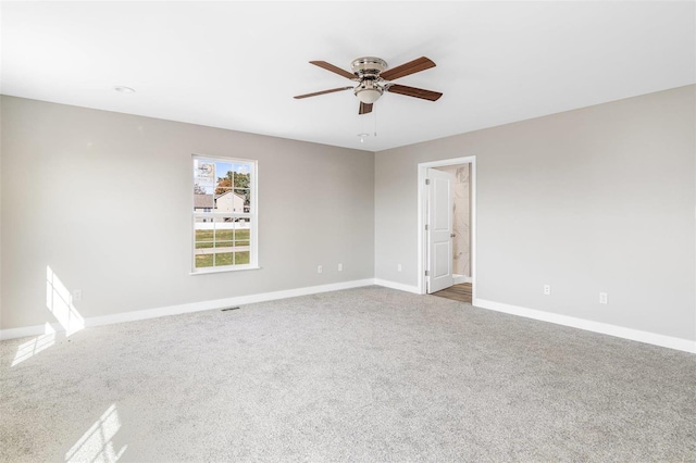 unfurnished room with carpet and ceiling fan